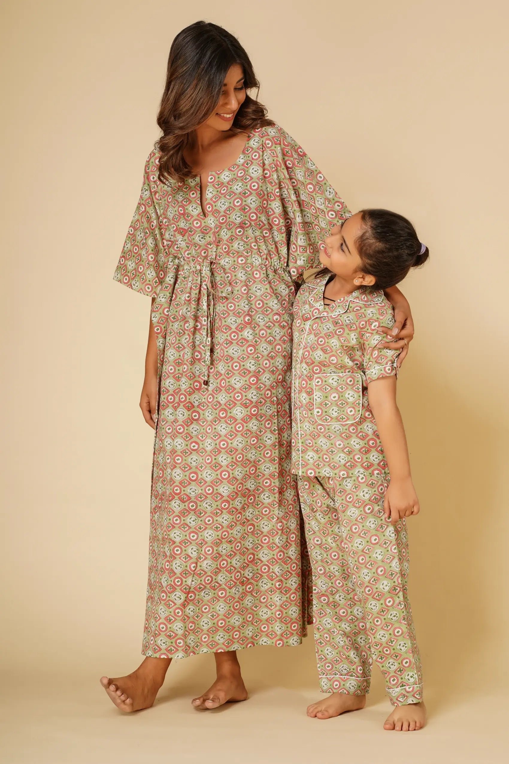 Green print unisex nightsuit for kids - Set of two