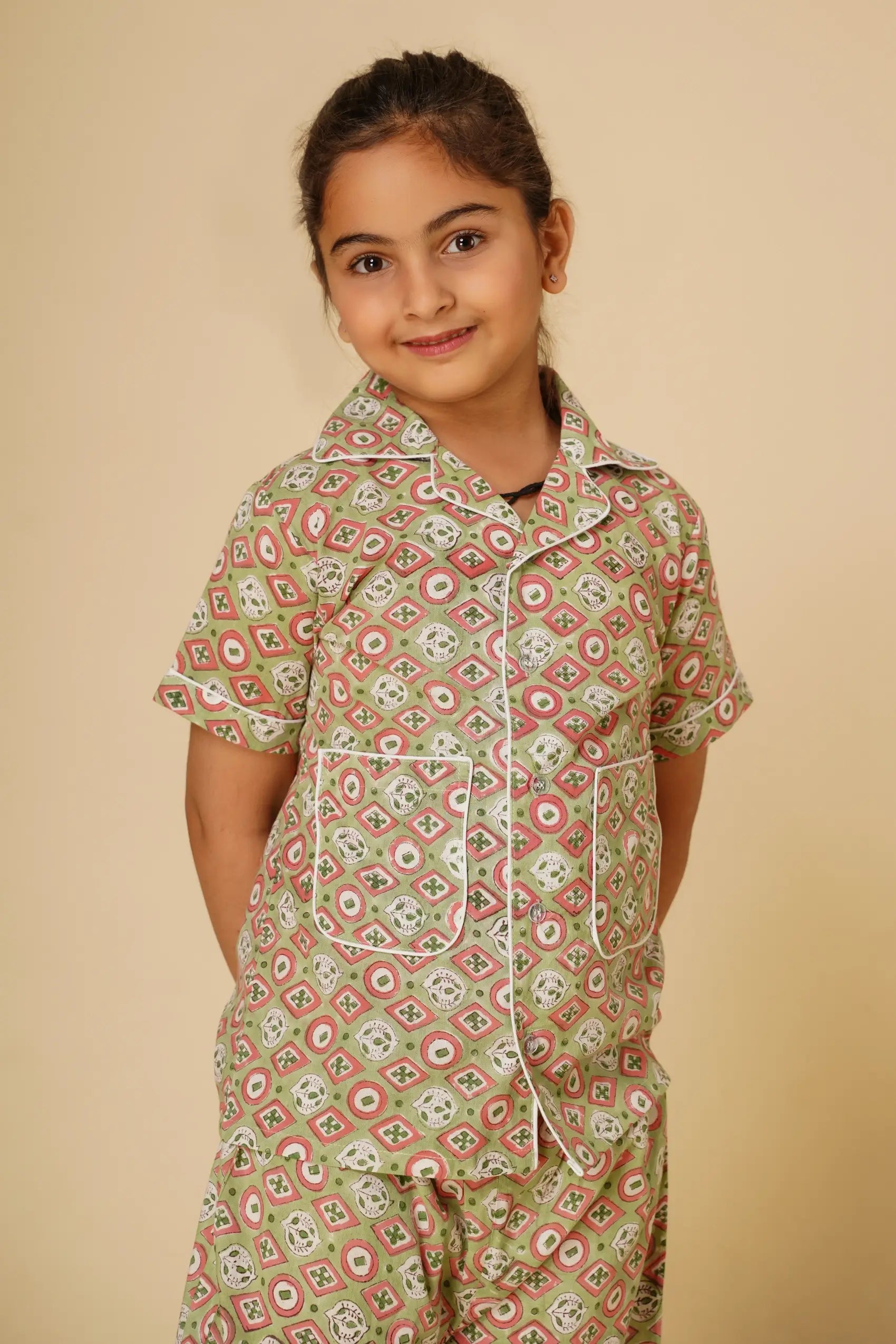 Green print unisex nightsuit for kids - Set of two